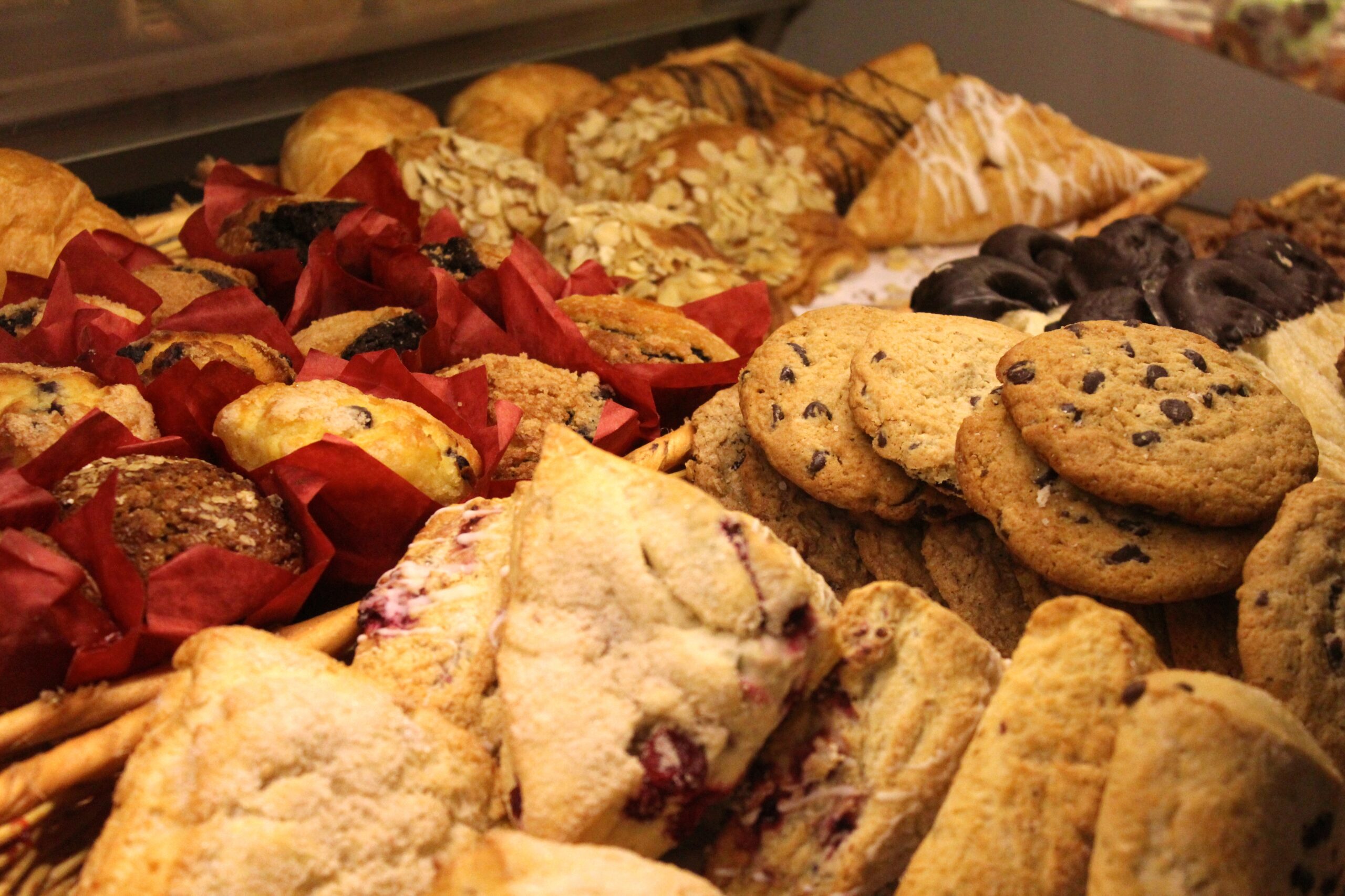 Image of various baked goods including scones, muffins, danishes, and cookies