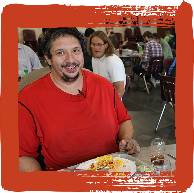 This is an image of a gentleman having a meal at Open Door Mission.